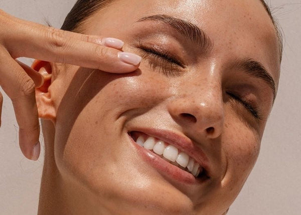 Close-up of a woman's face with a neutral background