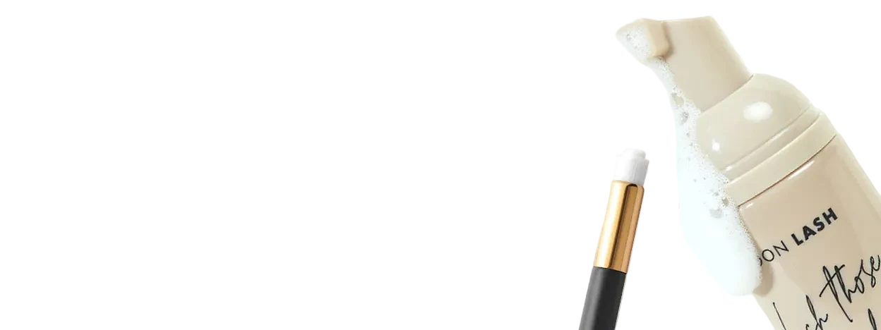 Eyelash product with applicator on a light beige background